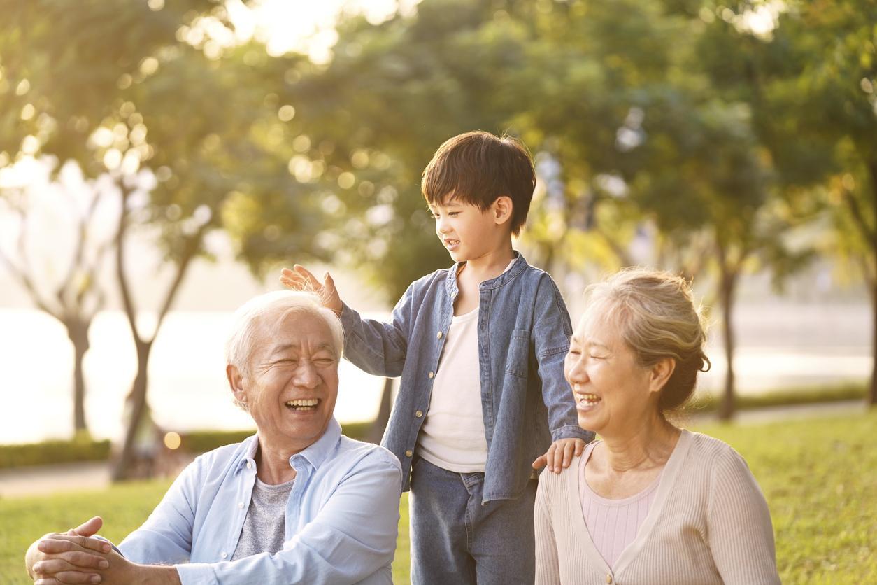 Senior grandparents with grandchild