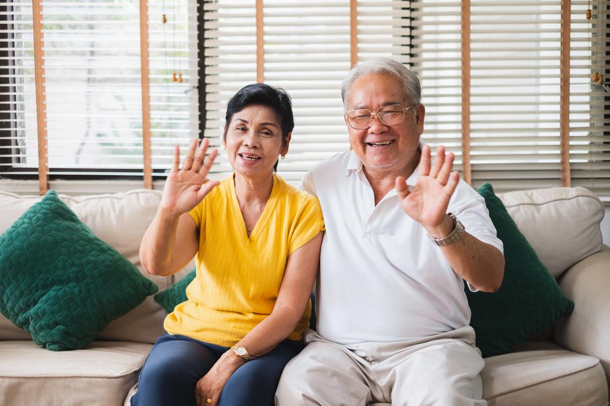 Chinese couple waving