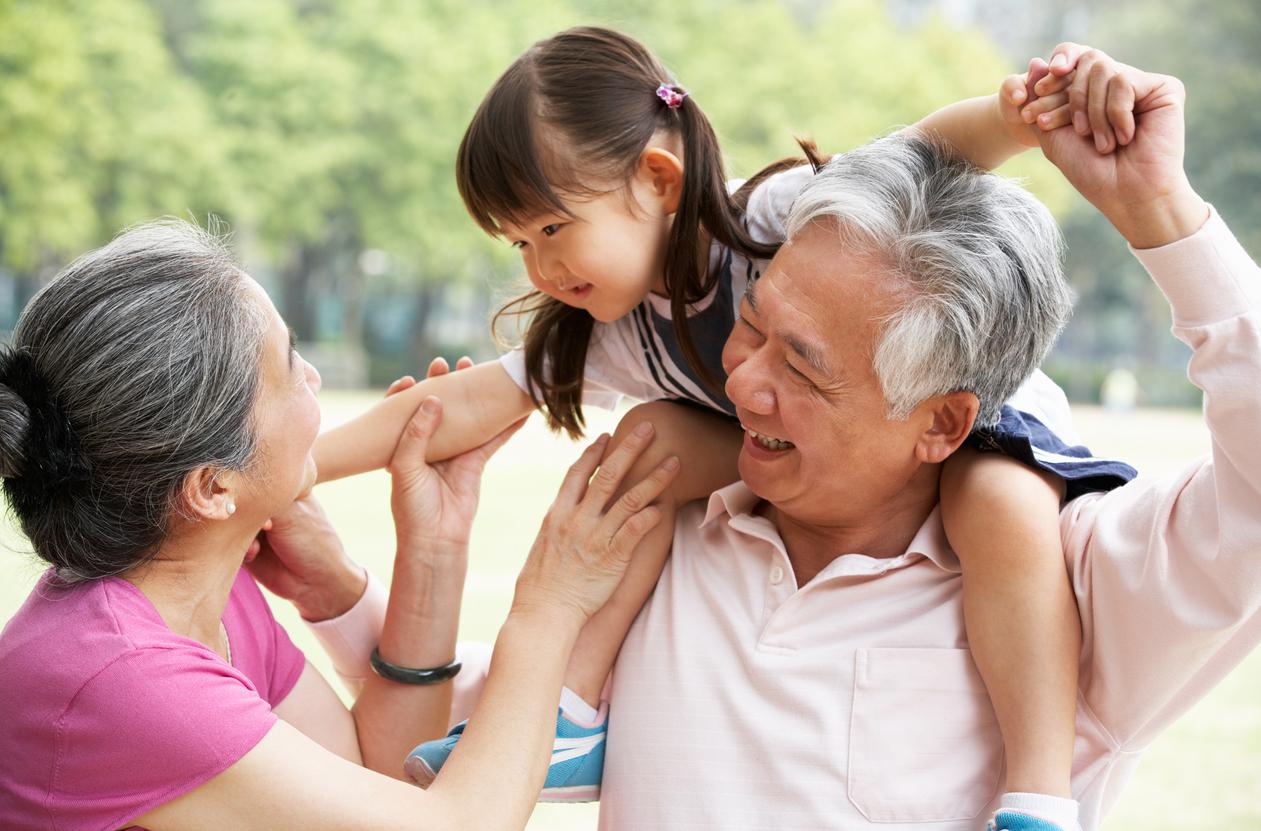 Senior grandparents with grandchild